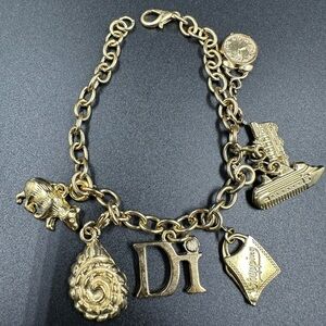 Diamond International DI Gold Tone Charm Bracelet Ship Clock Bear Train Rope
